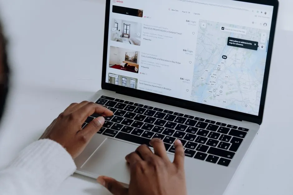 Editor researching and verifying a hotel promo code on a laptop